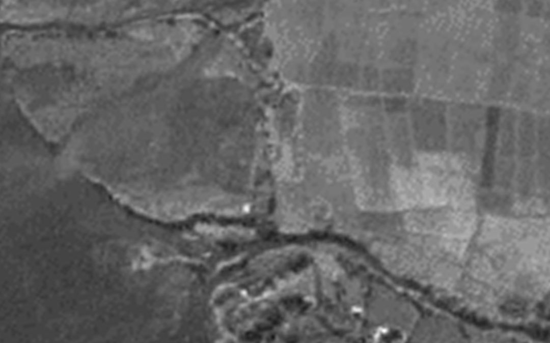 1967: An aerial photo shows a channelized Kawa Stream that flows directly into the bay.